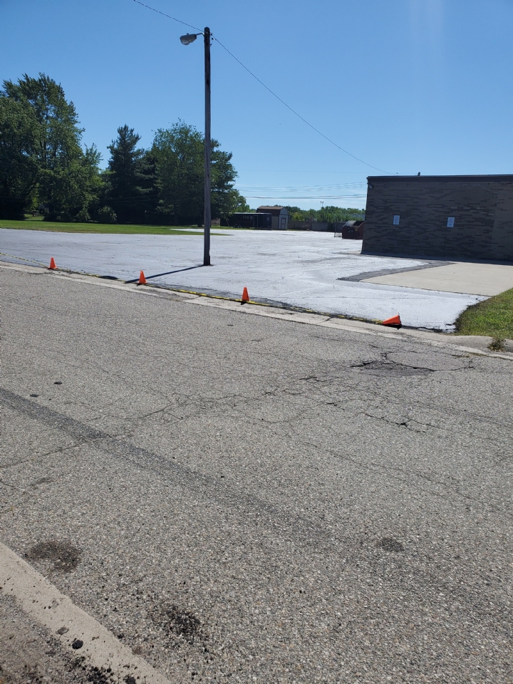 The main parking lot is complete except for a few touch up spots and the stripping.  That should be happening around Labor Day.